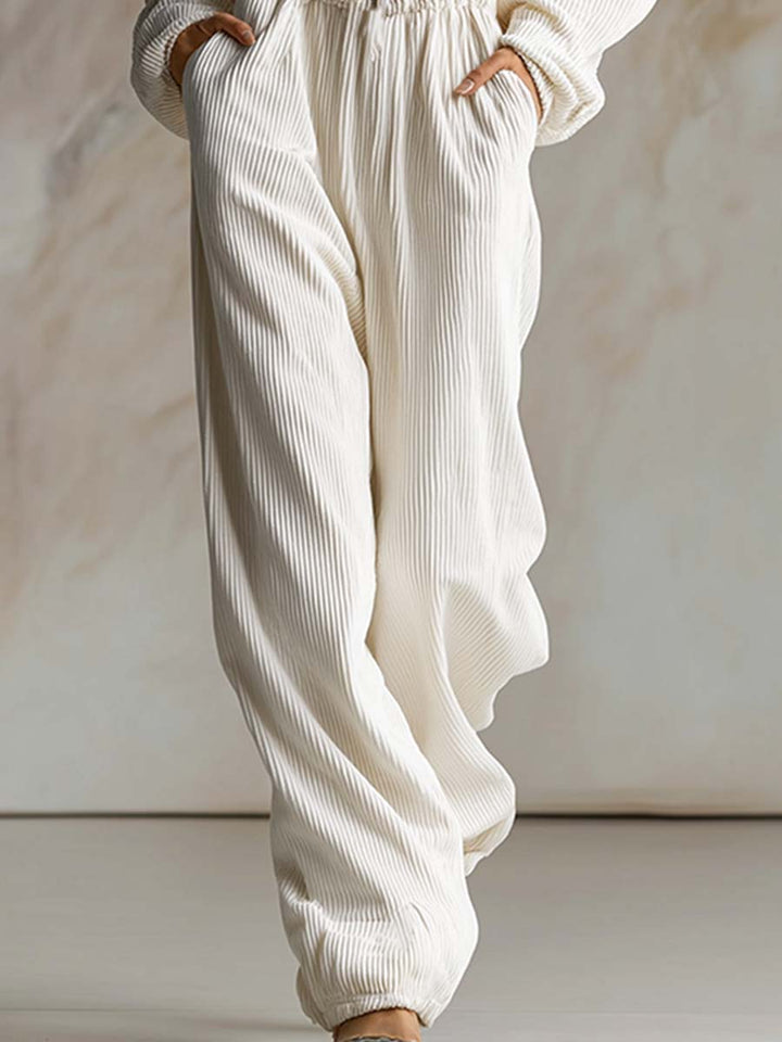 Mono casual holgado de pana blanca con capucha, cremallera frontal y manga larga, a la moda