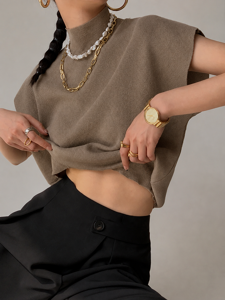 Noira | Top senza maniche da donna con collo alto e spalline imbottite