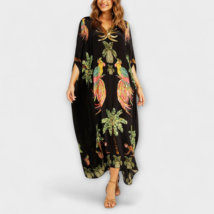 Linda - Vestido llamativo con hombros asimétricos y estampado de palmeras