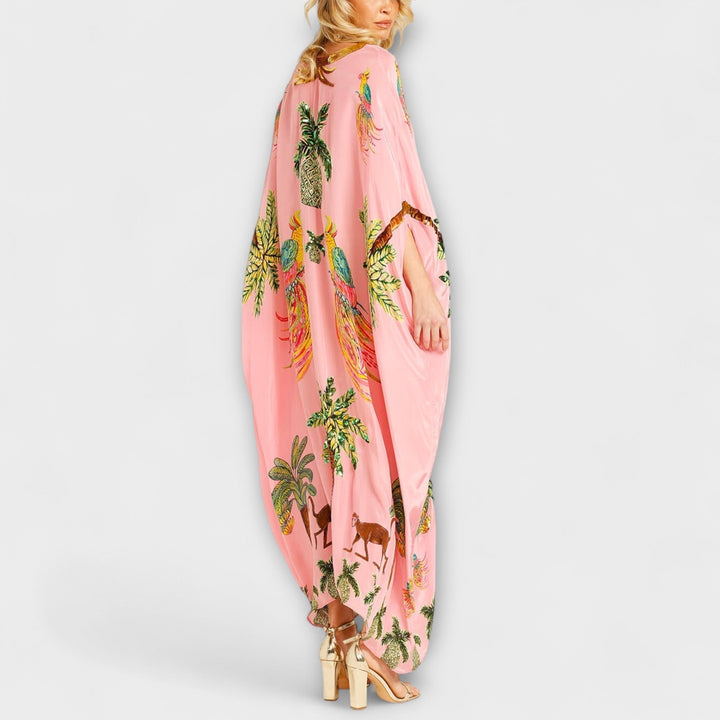 Linda - Vestido llamativo con hombros asimétricos y estampado de palmeras