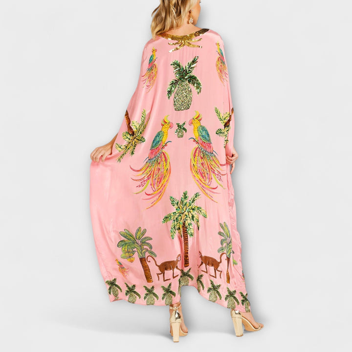 Linda - Vestido llamativo con hombros asimétricos y estampado de palmeras