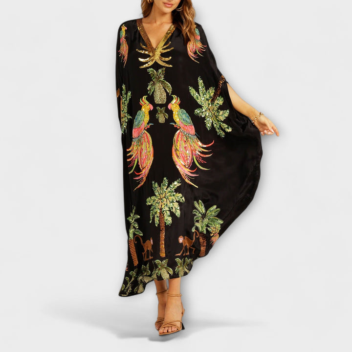 Linda - Vestido llamativo con hombros asimétricos y estampado de palmeras