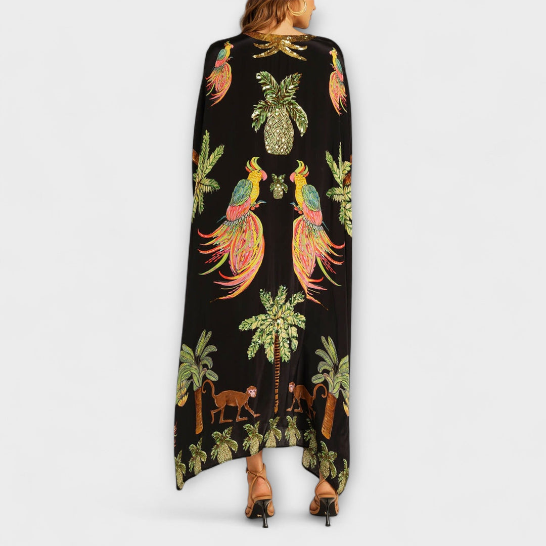 Linda - Vestido llamativo con hombros asimétricos y estampado de palmeras
