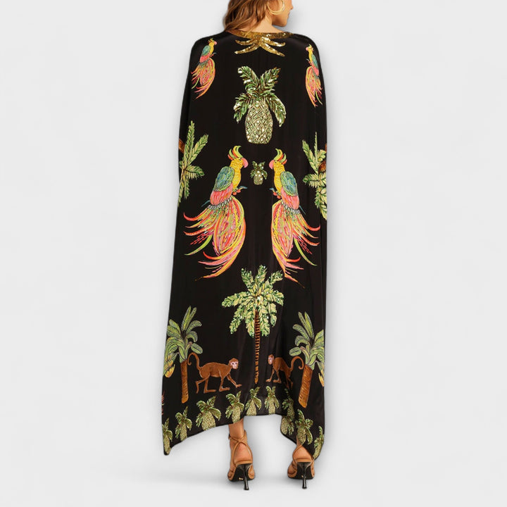 Linda - Vestido llamativo con hombros asimétricos y estampado de palmeras